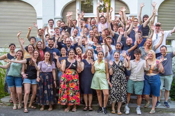 Group of CorrelCon participants on a staircase in front of a building