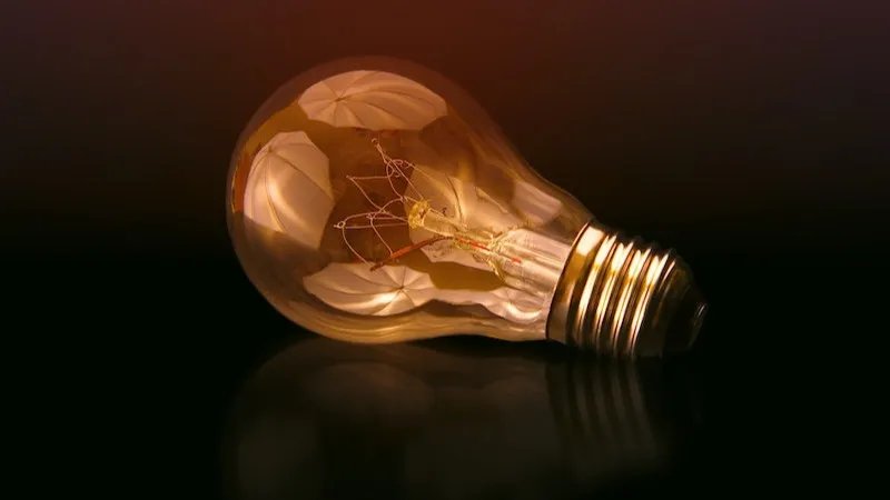 A lightbulb on black blackground