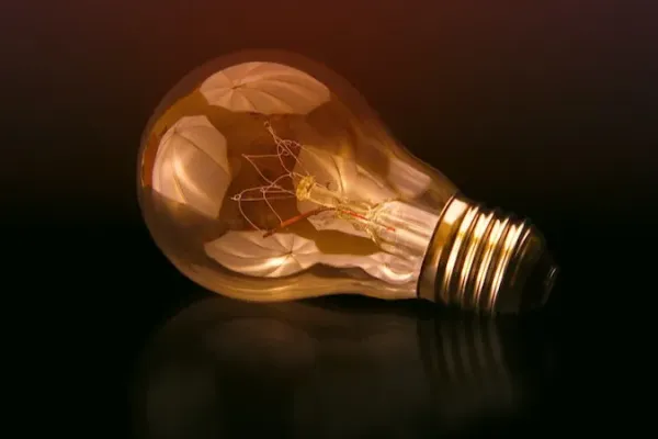 A lightbulb on black blackground